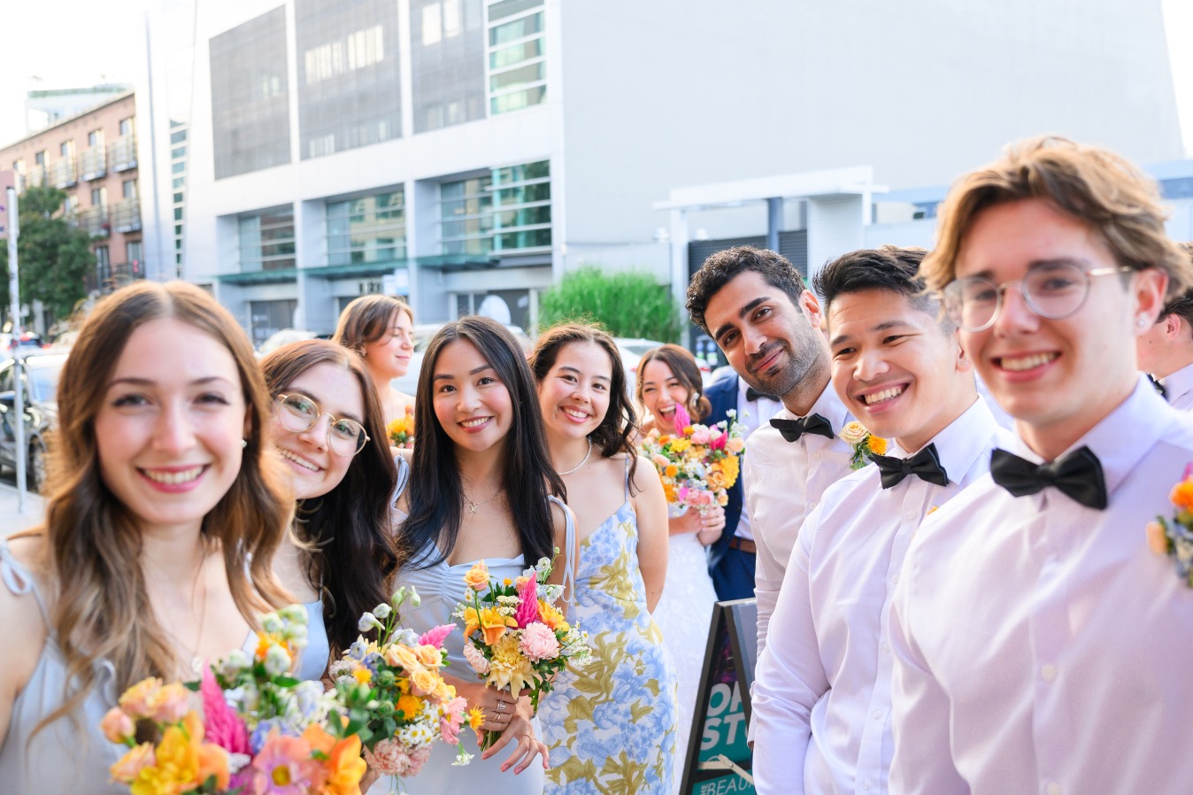 Wedding party group photo on the street