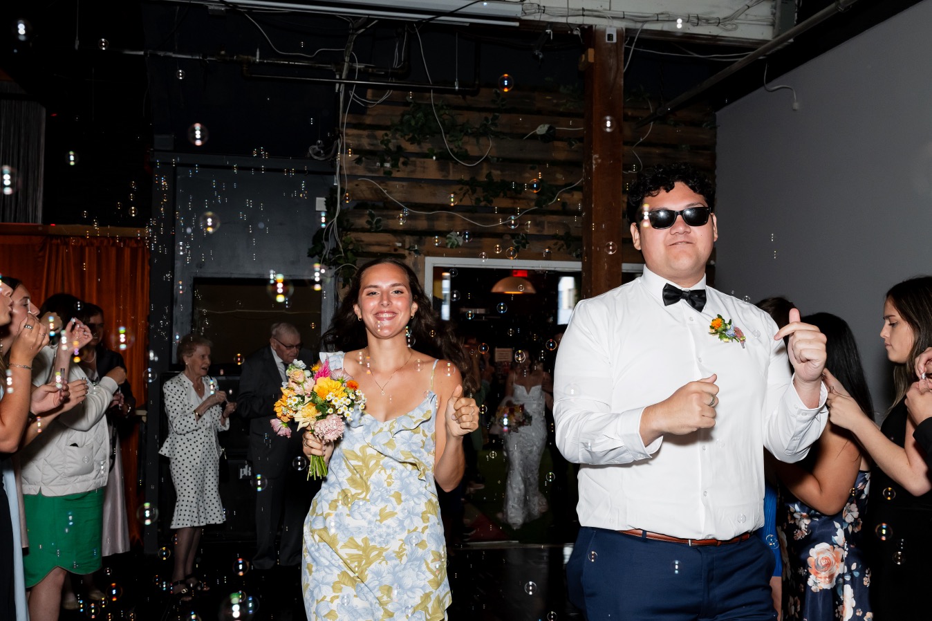 Bridesmaid and groomsman entrance with bubbles