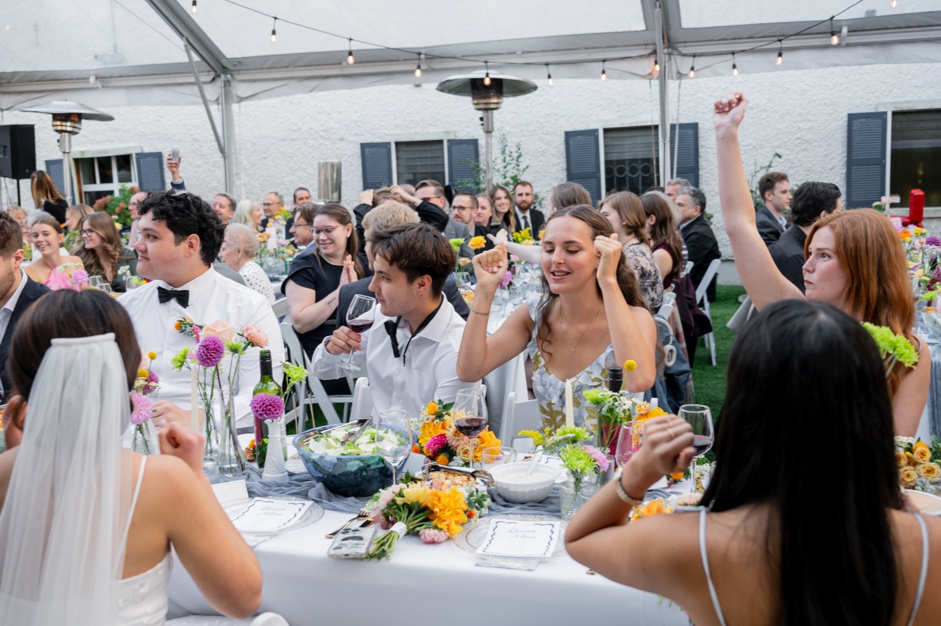 Guests cheering during reception dinner