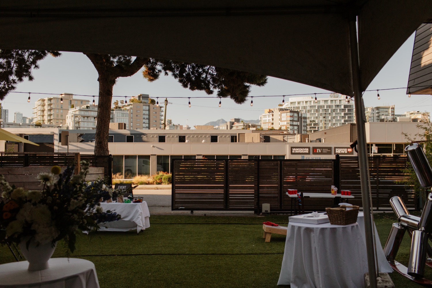 Beaumont courtyard patio setup with string lights and lawn games