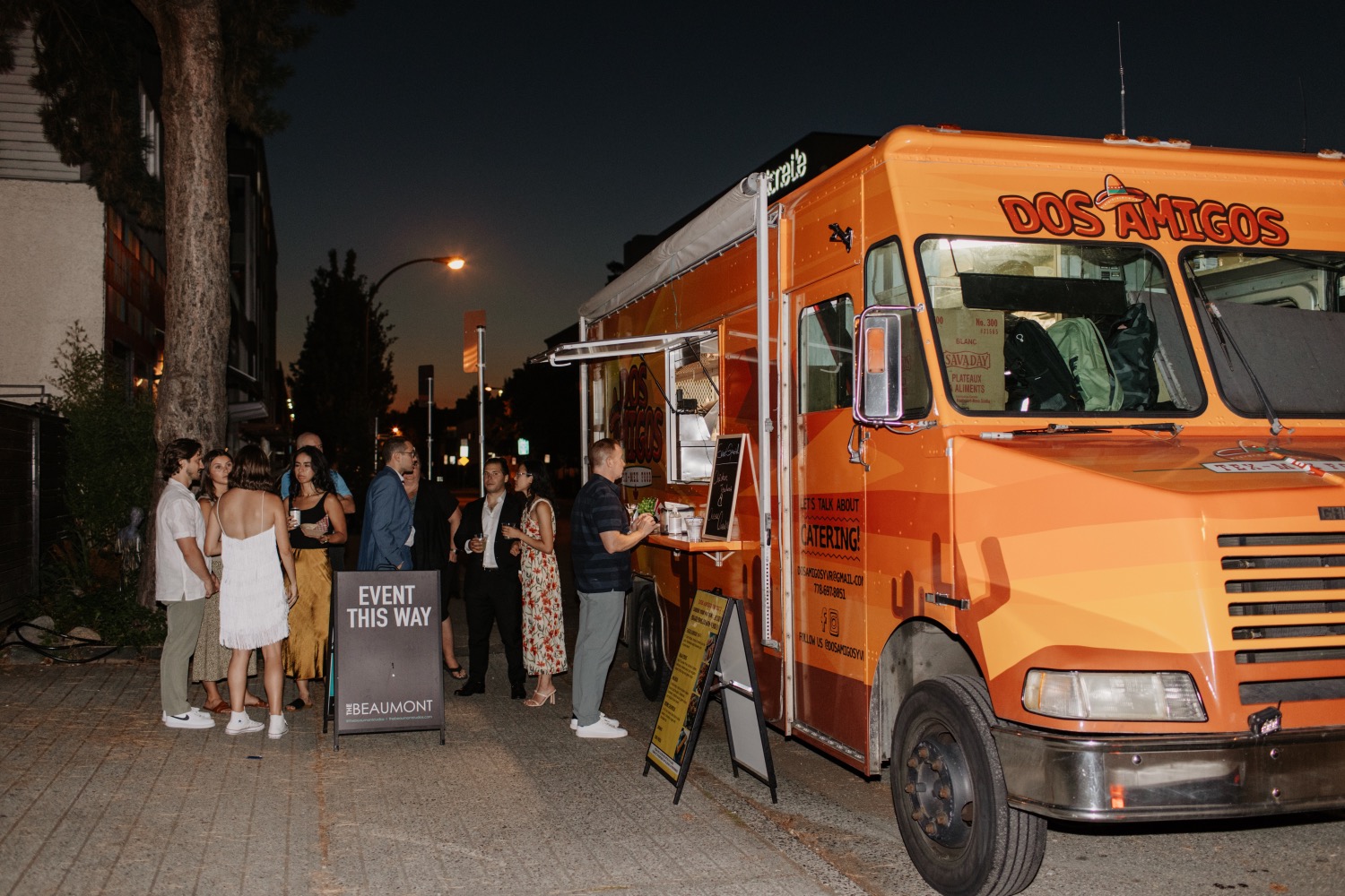 Wedding guests at the food truck outside The Beaumont